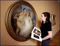 Woman viewing a painting
