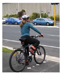 Side image - cyclist giving way to traffic. 