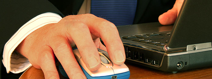 Clicking a computer mouse. 