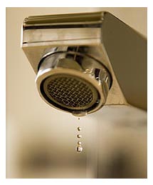 Side image - Water dripping from tap.