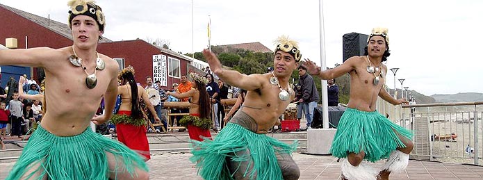 Banner image - three male dancers at luau.