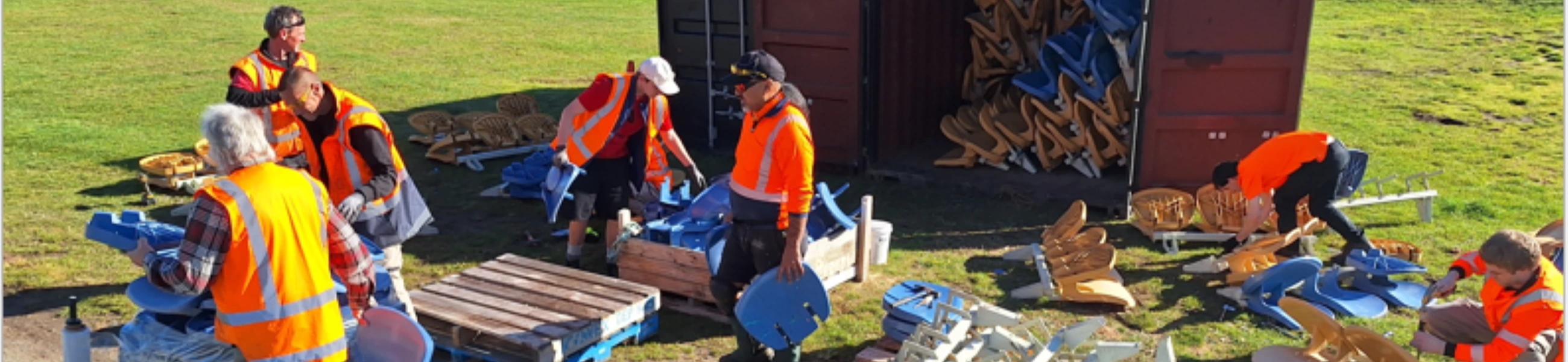 A crew of Task Force Green volunteers performing work outside.