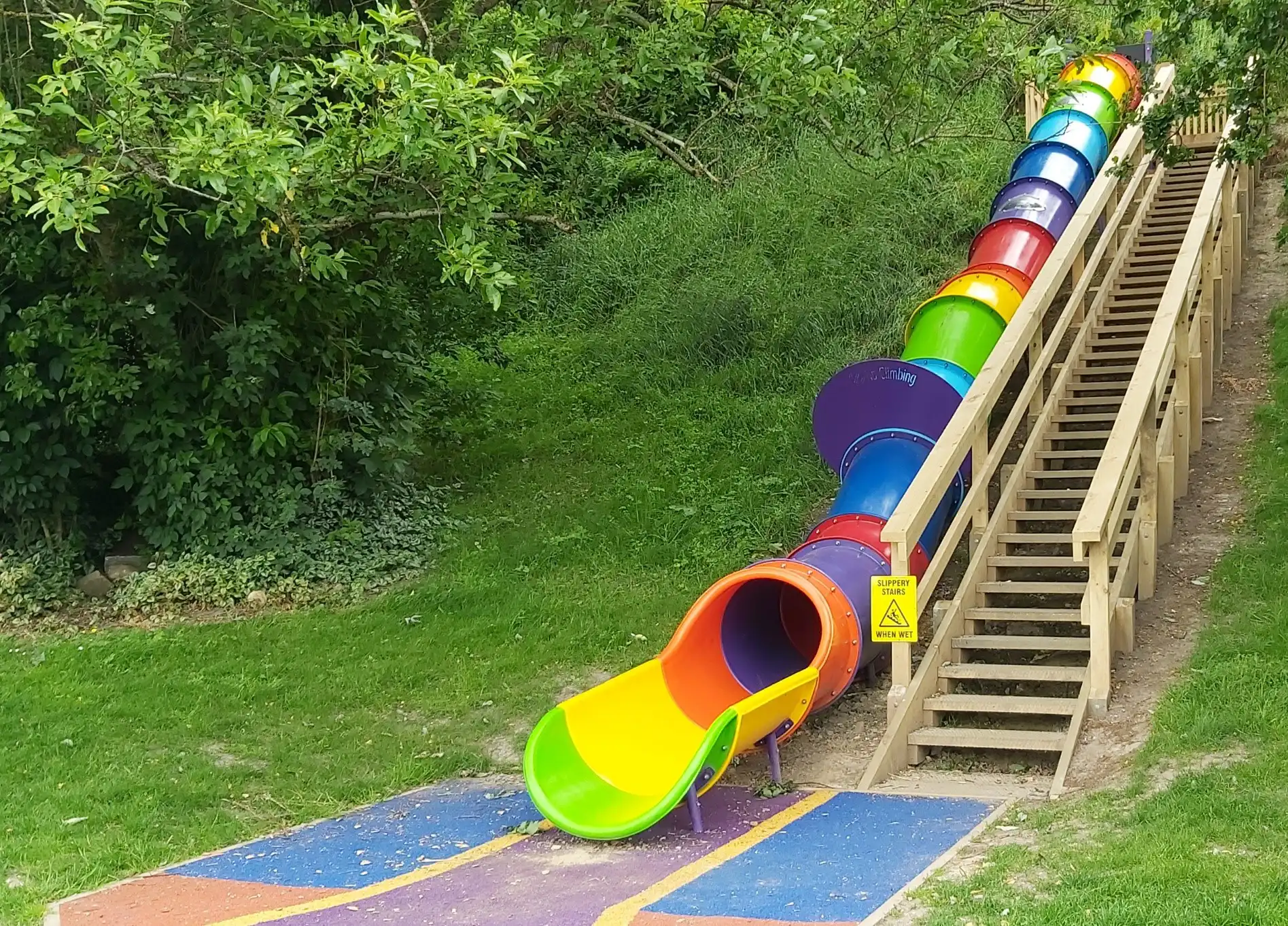 Rainbow tube slide at Matthew Street playground