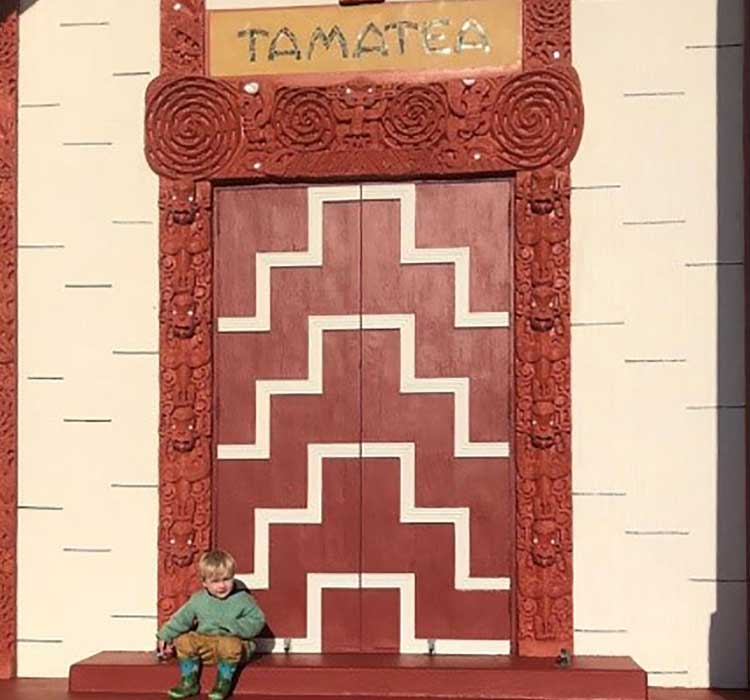 Ayesha’s cousin, Axel Portas, sitting on the steps of Tamatea