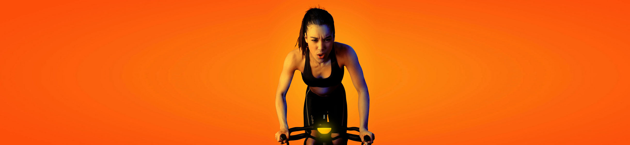 Orange girl cycling.