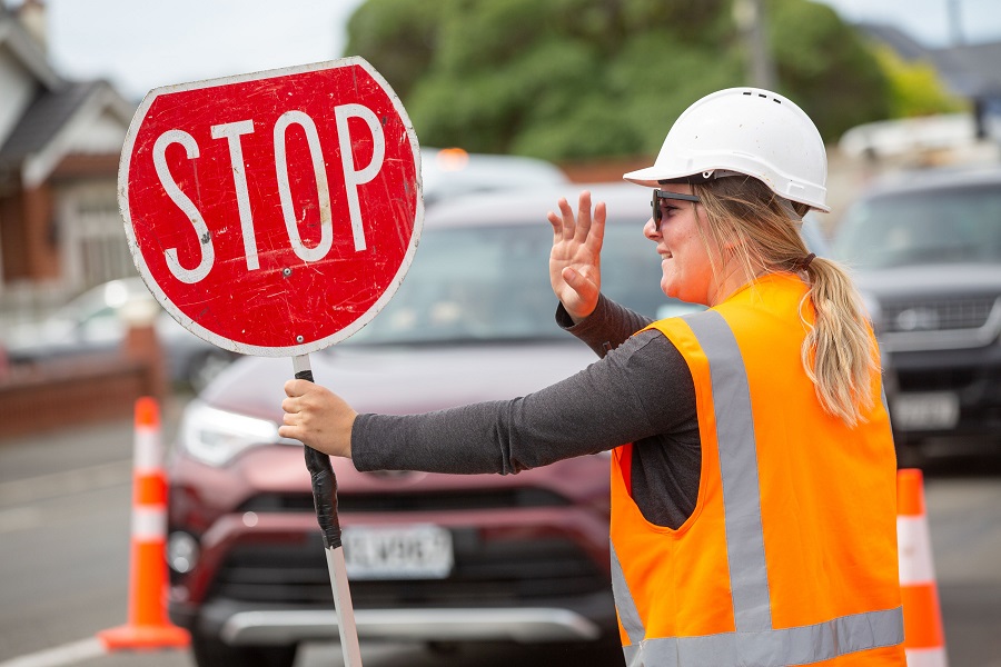 Woman with stop sign