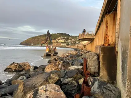 Placement of large rocks at St Clair seawall April 2024