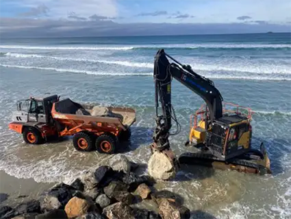 Placement of large rocks at St Clair seawall April 2024