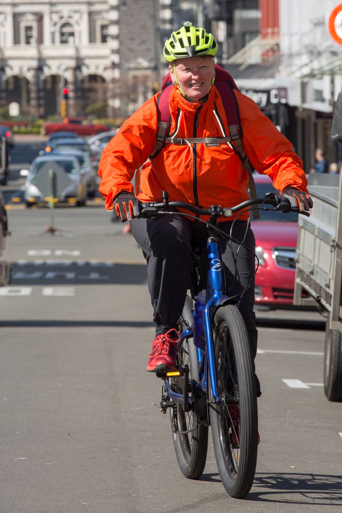 Woman cycling up Stuart Street Woman cycling up Stuart Street